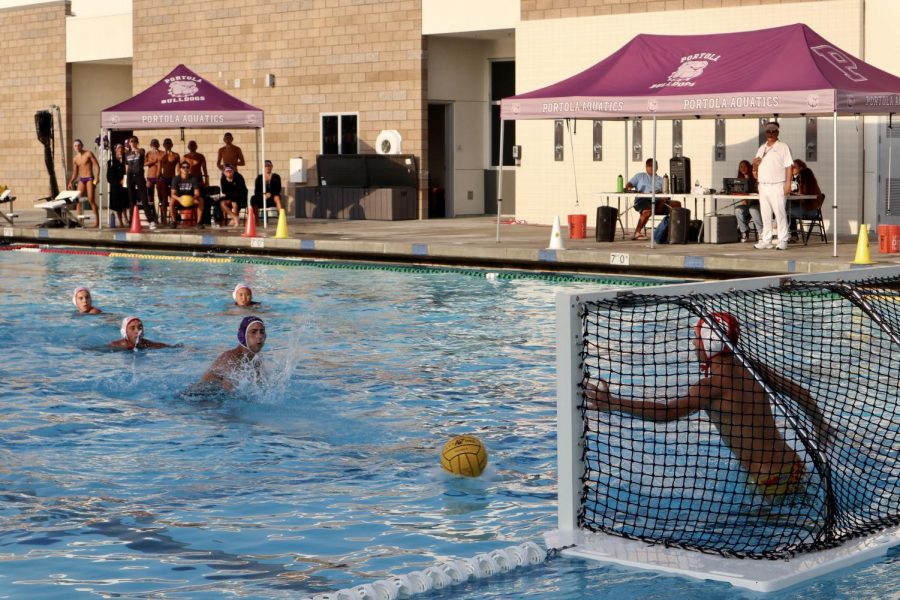 Sophomore Noam Garibi shoots the penalty shot on the goal from the 5- meter line during the second quarter. He scored four points in total throughout the game.  
