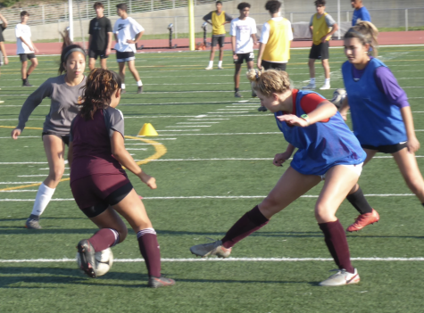 Junior Emma Song, junior Citlali Garcia-Montero, sophomore Jadyn Kohan, and junior Xasive Espinosa practice offense and defense during a two-on-two drill during practice on Nov. 9. In addition to sport-specific technique, winter sports athletes also condition through regular fitness exercises and work to lower injury risks by warming up before practice or play, according to assistant athletics director Brian Smith.