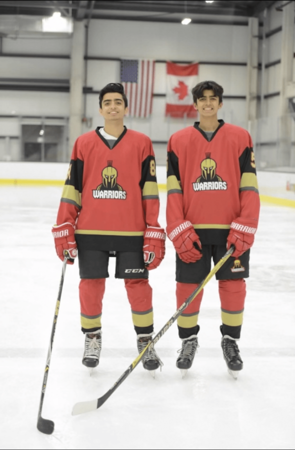 Alumnus Kiyan Dhanidina and senior Khalil Dhanidina show off their Irvine United Warriors gear. Khalil Dhanidina is currently one of the captains of the hockey team.