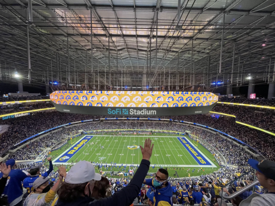 Rams+fans+cheer+in+SoFi+Stadium+after+their+team+scores+a+touchdown+against+the+Cardinals+on+Jan.+17+in+the+wild-card+round.+The+Rams+won+the+game+with+a+score+of+34-11+and+will+face+the+Buccaneers+in+Tampa+Bay+on+Jan.+23+in+the+divisional+round.++Senior+Maanas+Kollegal%2C+who+is+a+Rams+season+ticket+holder%2C+attended+the+game+with+his+family.+
