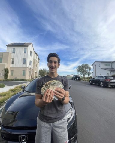 After senior Kian Miremadi won, he took a photo with the winning jackpot amount of $1,220. 
