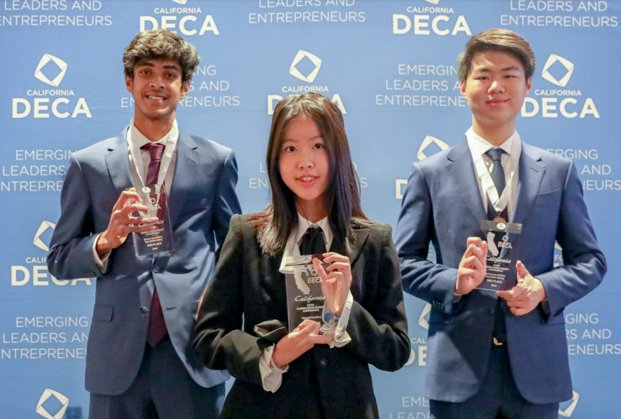 Senior Aryan Shrivastava, junior Jenny Zhang and senior Howard Zhang present their trophies for qualifying for the International Career Development Conference. Six out of 11 Portola High delegates placed as finalists.
