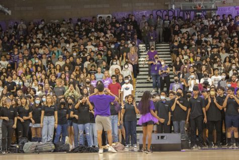 Girls’ athletics commissioner and senior Alex Richmond and junior class president Michael Shen lead juniors and sophomores in the Bulldog Rumble, one of the new school cheers introduced at the rally.