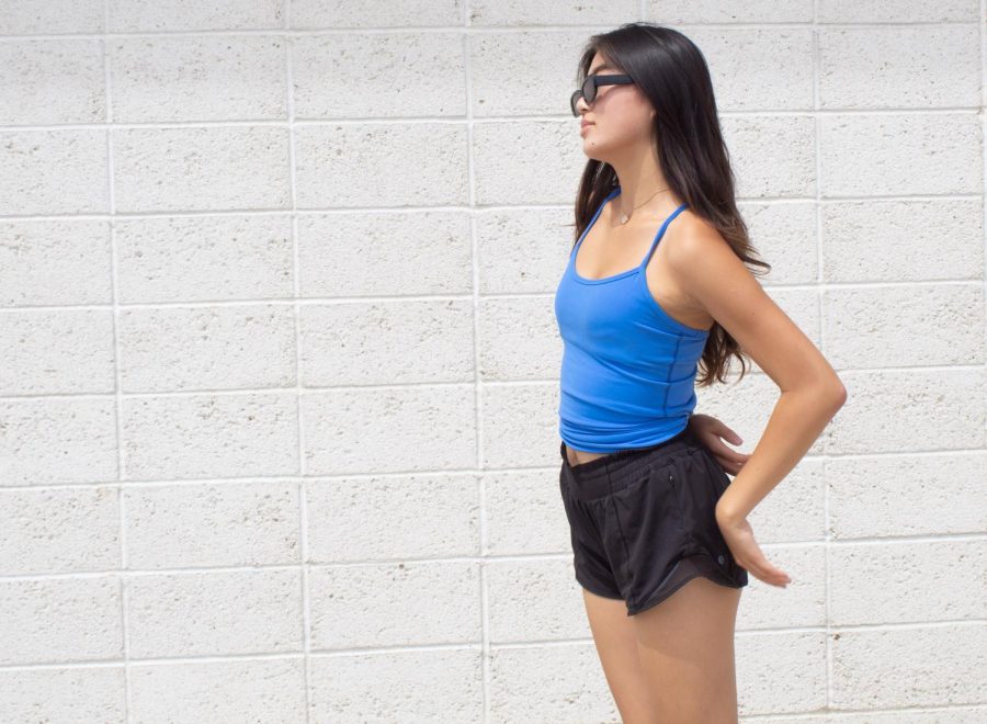 Vintage slim sunglasses: Although sophomore Lisa Liu’s outfit might seem simple with her blue Lululemon tank top and shorts, she accessorizes her outfit with a pair of vintage slim sunglasses. Eyewear accessories are an easy way to complement and enhance a fit, according to Liu. “I wear sunglasses almost every day, and I feel that they can really elevate your outfits,” Liu said. “I love buying them because they really go well with basically any look.”