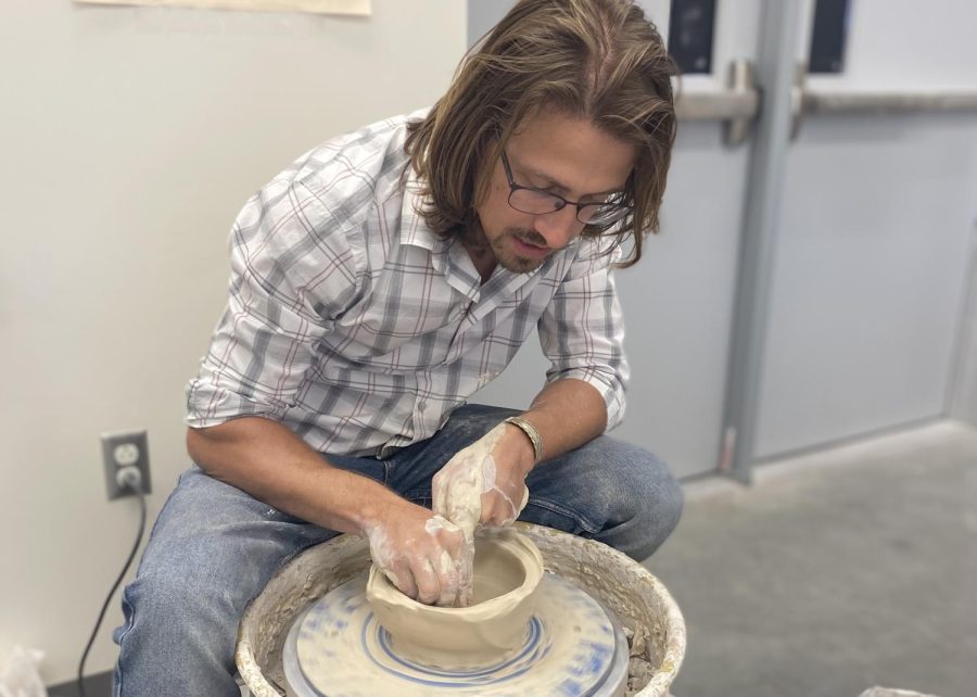 Ceramics%2C+photography+and+art+teacher+Donovan+Miller+demonstrates+how+to+throw+a+plant+pot+to+his+advanced+and+AP+3D+design+students.+The+funds+raised+from+selling+the+pots+will+go+toward+helping+the+visual+art+board+to+raise+funds+for+its+annual+show.%E2%80%9CI+dont+have+a+ton+of+time+to+make+my+own+artwork+anymore%2C%E2%80%9D+Miller+said.+%E2%80%9CNormally+when+I+do+a+demonstration+for+a+project%2C+I+like+to+use+that+as+an+opportunity+to+kind+of+explore+my+interest+in+art.%E2%80%9D