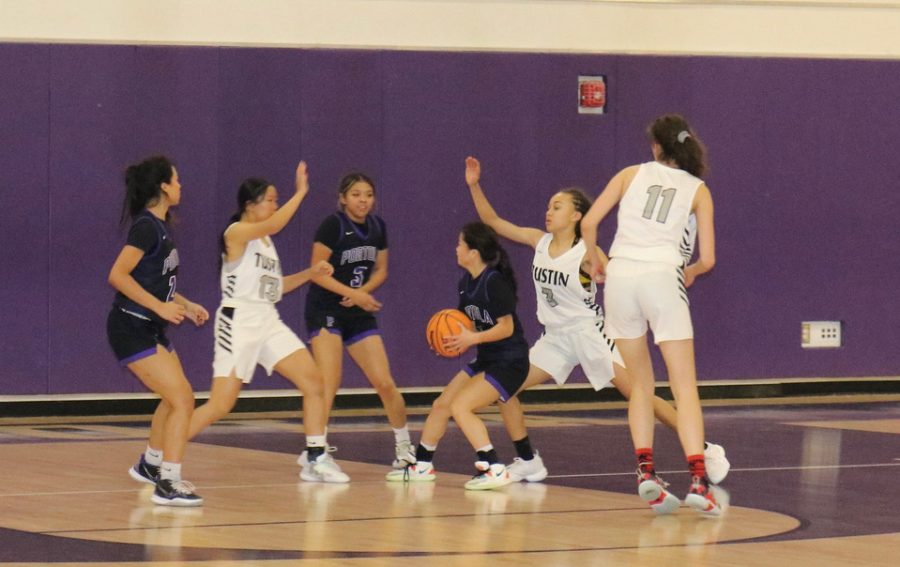 Junior+girls%E2%80%99+basketball+player+Kira+Watanabe+aims+to+shoot+for+the+basket%2C+as+the+Tillers+attempt+to+block+her+from+making+the+hoop%2C+while+sophomore+Nanami+Jackson+and+junior+Kalynne+Abraham+Mendez+try+to+help.+