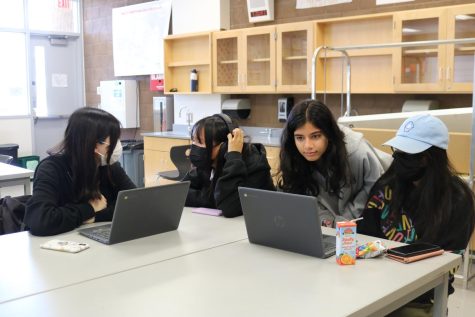 President and junior Injila Adil helps members during a workshop on coding with consideration of syntax. “Its my first year doing this club, and so far I think its a great experience,”  sophomore Shriya Ravipati said. “I dont know coding that well, so the others are helping me learn. I feel like coding is just a good skill to have.”