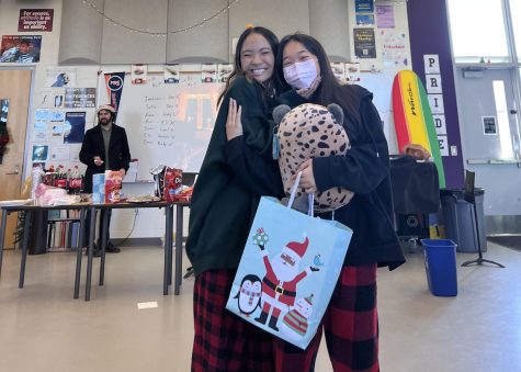Junior Kady Lin and sophomore Carol Chiang hug each other after the annual Secret Sister hosted by Canta Bella members. They both received each other as their Secret Sister and were able to enjoy some snacks like cookies and a “Canta Slay” cake after.