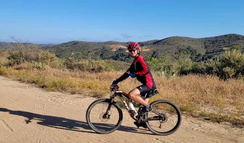 Sophomore Brandon Phomsavanh stops at the middle of the Moro Ridge Road trail in Crystal Cove State Park during one of many mountain bike rides with his father, Lee Phomsavanh.