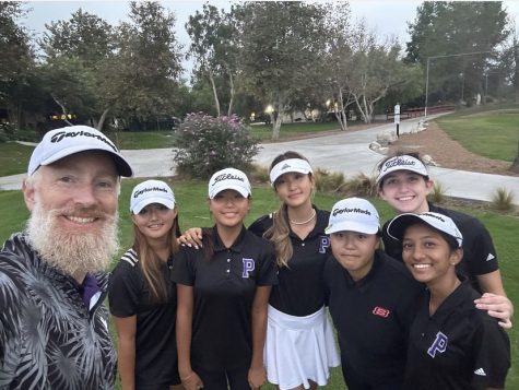 Social studies teacher Wind Ralston takes a photo with the girls golf team to celebrate winning CIF Division 3. “Hes always ready for the team whenever we need it,” sophomore Katie Le said. “If we have a question, hes right there ready to respond through text message or email.”