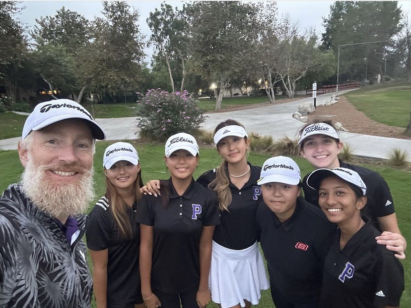 Social+studies+teacher+Wind+Ralston+takes+a+photo+with+the+girls+golf+team+to+celebrate+winning+CIF+Division+3.+%E2%80%9CHes+always+ready+for+the+team+whenever+we+need+it%2C%E2%80%9D+sophomore+Katie+Le+said.+%E2%80%9CIf+we+have+a+question%2C+hes+right+there+ready+to+respond+through+text+message+or+email.%E2%80%9D