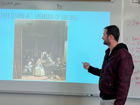 Math teacher Eric Graham presents “Las Meninas” by Diego Velázquez to his class. Out of all the artwork Graham has seen over the years, he says that “Las Meninas” is his favorite piece because of the story and intricate details that the painting holds. 