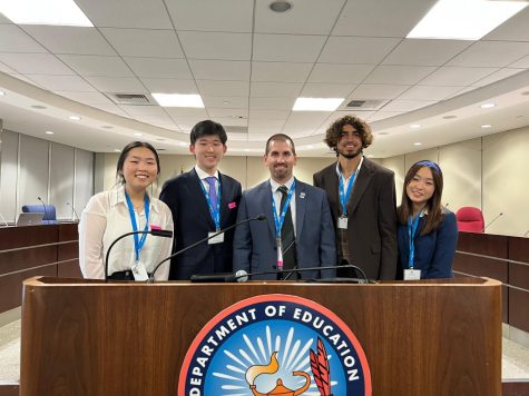 Senior David Kim, alumna Abby Kwon, social studies department chair Jon Resendez, and alumni Amar Malik and Anne Wu gather at the Department of Education in Sacramento on March 10, 2022. 