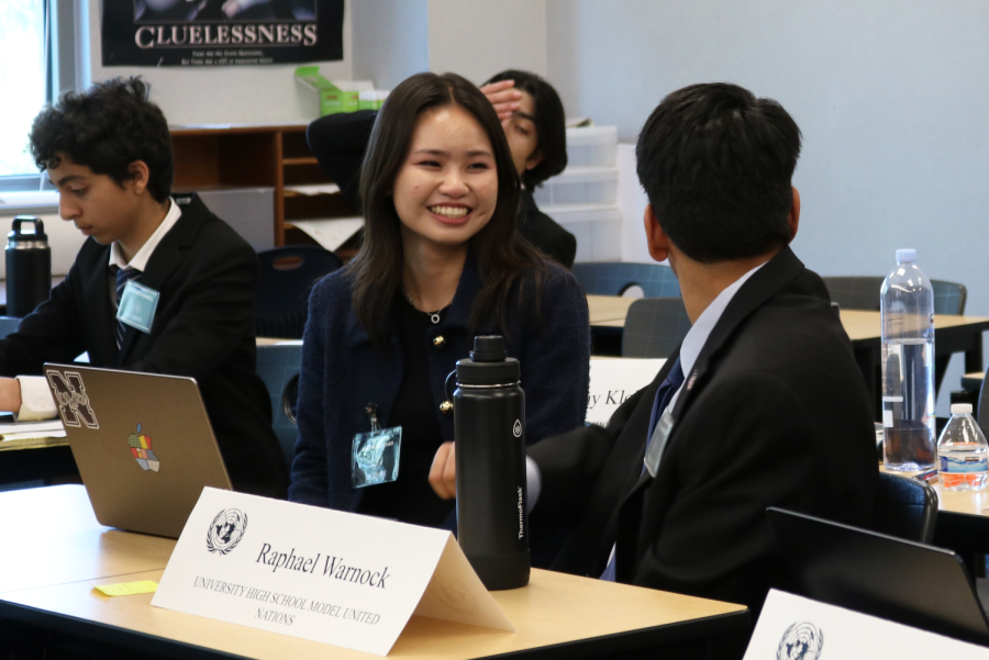 Sophomore Katie Le laughs as she talks to delegates from other local high schools in the U.S. Senate committee about the possible solutions their bloc could propose to combat domestic terrorism. “It’s all about fun, first of all, and some of them were able to practice their public speaking, practice their research skills and practice their ability to follow specific procedures and formats to reach goals,” MUN adviser and social studies teacher Daniel Hunter said.