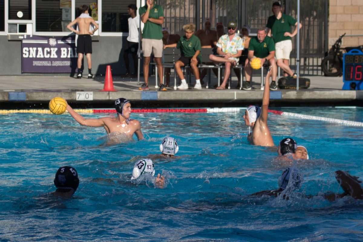 Attacker and junior Ryder Tonkovich cocks his arm to score a point against Long Beach Poly High in the second quarter. The Bulldogs’ win against the Jackrabbits added to their long list of victories this season, allowing them to build their momentum and confidence, according to head boys’ water polo coach Kate Avery. “We have been playing some good teams and weve come out on top, which is great,” Avery said. “Our offense is looking really good. Our defense has been looking fine. We can always improve there. We are a defensive-minded team anyways.”