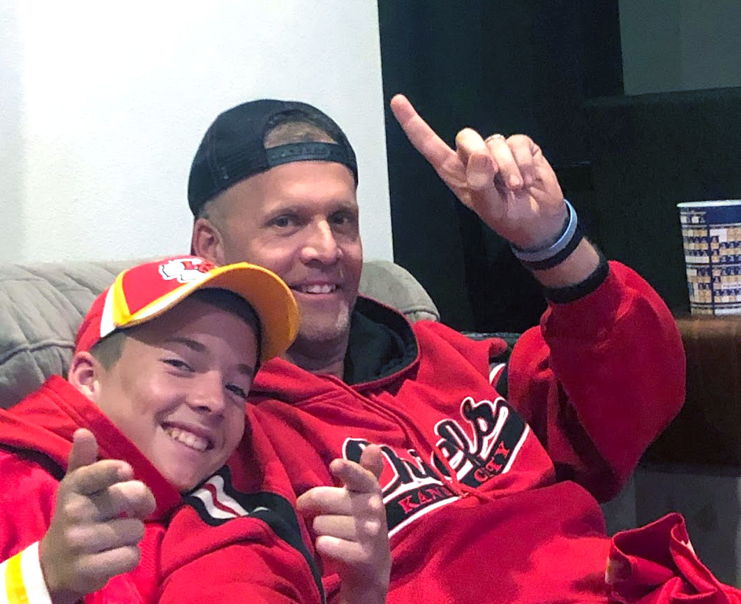 Social studies teacher Brian Smith and his son Brock joyfully watch the Kansas City Chiefs win the Super Bowl on Feb. 2, 2020. Smith, who grew up in Kansas City, regularly attended games at Arrowhead Stadium as a teenager. “There’s no place like Arrowhead to watch a football game, and that’s just what my family did.” Smith said. “In the Kansas City area, everybody’s a Chiefs fan, so it’s just part of the culture. They would give us days off of school if the Chiefs were playing a big game.” Although Smith has not been to a Chiefs game in over 20 years, he keeps his love for the team alive by discussing football with his classes.