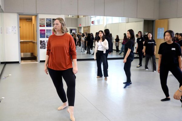 Dance and French teacher Megan Kirby instructs Dance 1 students on the proper form and technique of pique turns. “Theres a lot of learning from mistakes involved and developing skill[s] and having a growth mindset,” Kirby said.