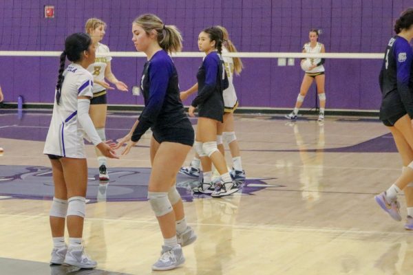 Izzy Macasero congratulates teammate and senior Madison Curran after scoring a point. “Mac has incredible energy and positivity that she brings onto the court,” head coach Eric Graham said. “She always has a smile on her face. Shes always looking out for her teammates, doing whatever she can to lift them up and have them be successful.”