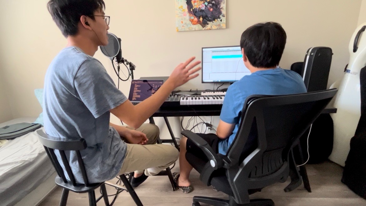 Senior Jeremy Chae sings as sophomore Caleb Shin records his voice with a production software. Despite being the band’s lead vocalist, Chae’s primary instrument was not always voice. “Honestly, I never thought that I would sing,” Chae said. “I thought it was really scary, even though I did play violin. I never really liked the idea of performance.”