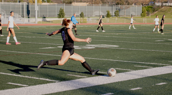 Defensive center midfielder, captain and senior Jaydn Kohan kicks the ball to the other side of the field for her teammates to receive. “I think it was a fair result, but I also thought we had a chance to win if we got one or two of the chances that we had,” head girls’ soccer coach Joshua Stringer said. “Our goal was to kind of counter into the space that we created by defending a little bit farther back in the field.”
