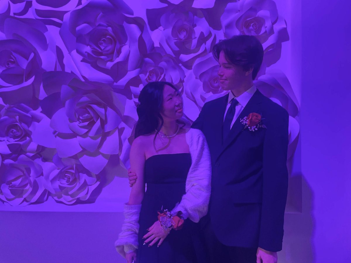 Sophomore Sophia Kim and Parker Abernathy from Foothill High gaze into each other’s eyes at the start of their romantic night at Winter Formal. Couples often match their corsages and boutonnieres, and the male often wears a tie that is the same color as their date’s dress.