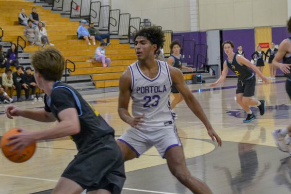 Senior Krishna Gade guards a Marina High player against advancing farther. “He was a big presence for us on the court,” head coach Brian Smith said. “More than that he was excited to be playing, he had basketball taken away from him, so he was enjoying being back out there.” 