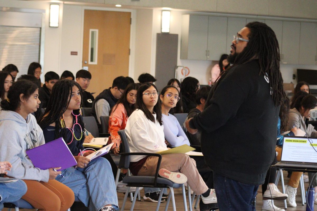 Speaker Alvia Lee addresses an audience of students from different schools during his workshop at the High School Youth Action teen’s (HSYAT) teen summit event. The workshop centered on mission and vision and included recountings of the speaker’s lived experiences. “It was nice that we were able to work with the people beside us,” teen summit attendee and sophomore May Li said. “The most memorable aspect was when the speaker wanted us to ask them what our best traits were, because sometimes you might not notice what they are until you’re told.”
