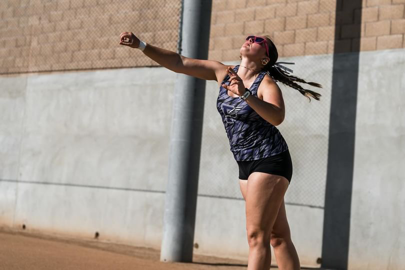 Junior Abbey Reichard throws a 4 kilogram ball into the air during the meet. Reichard’s team was very proud of her, according to teammate and junior Chrisma Agbor. “We were really excited, and we all ran up to her,” Agbor said.