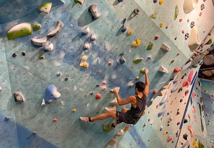 Senior Ernest Lin takes on one of the hardest routes the indoor rock climbing gym Sender One Climbing has to offer, which is where he often spends his free time to build strength and resilience.