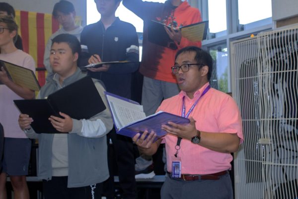 Student Teacher David Pulanco leads the treble and bass choir through warmups at the beginning of class. “Probably my favorite thing about the students at Portola is how dedicated they are to the program,” Pulanco said. “They really love working for the music. They really love working hard to get the music done. It's a passion that I don't see a lot of in students.”