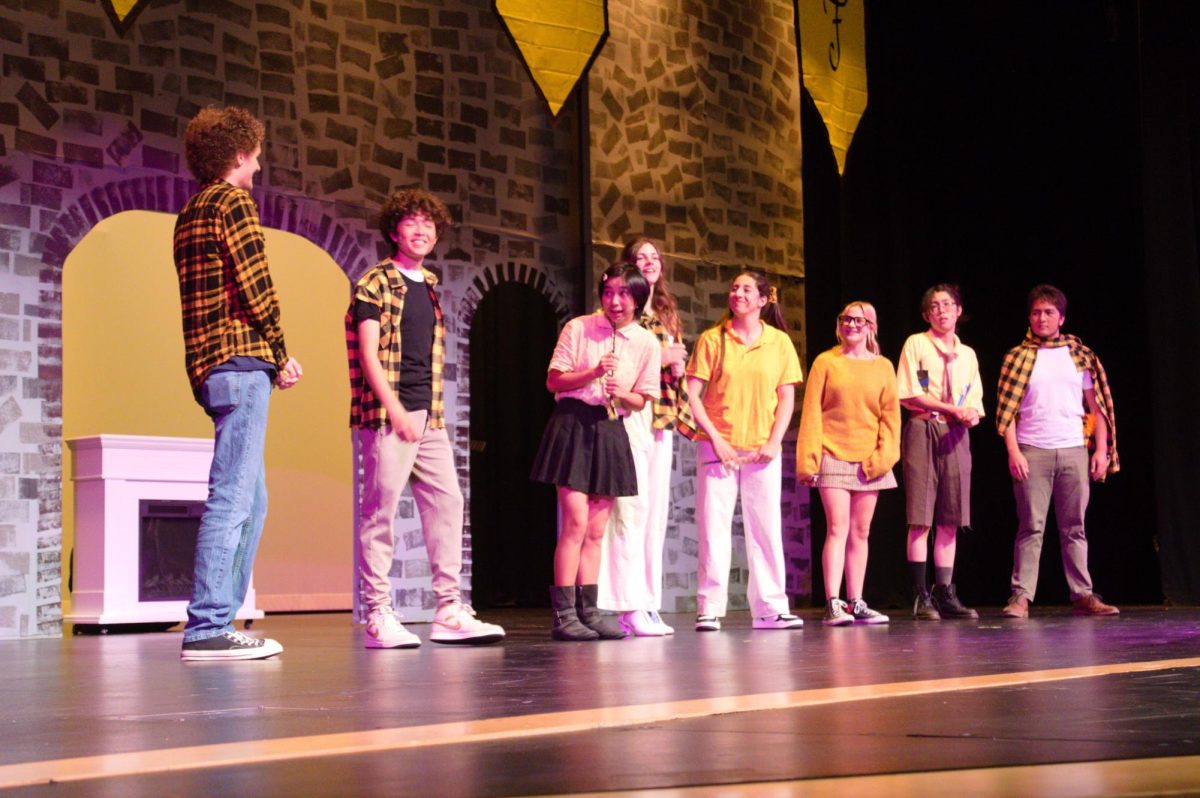 Senior Hau Le takes the lead as the students featured in the fall play ‘Puffs’ introduce themselves while clad in yellow costumes, configured by Tech Theatre. “Closing night, the audience was fantastic. I remember the end scene, the battle scene, people were screaming, people were laughing,” Sally Perks and sophomore Coco Marshall said. 