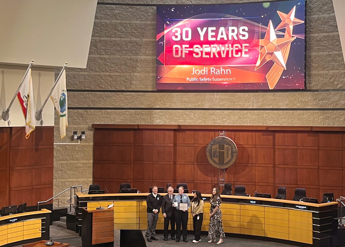 City of Irvine Peer Support Team Coordinator Jodi Rahn accepts an award honoring her 30 years of service to the Irvine Community. “Jodi has this rare combination of being compassionate and caring, but also incredibly hard working and tenacious, and that's just something that you don’t often find in the same person,” Assistant Chief of Police Noelle Smiley said. 