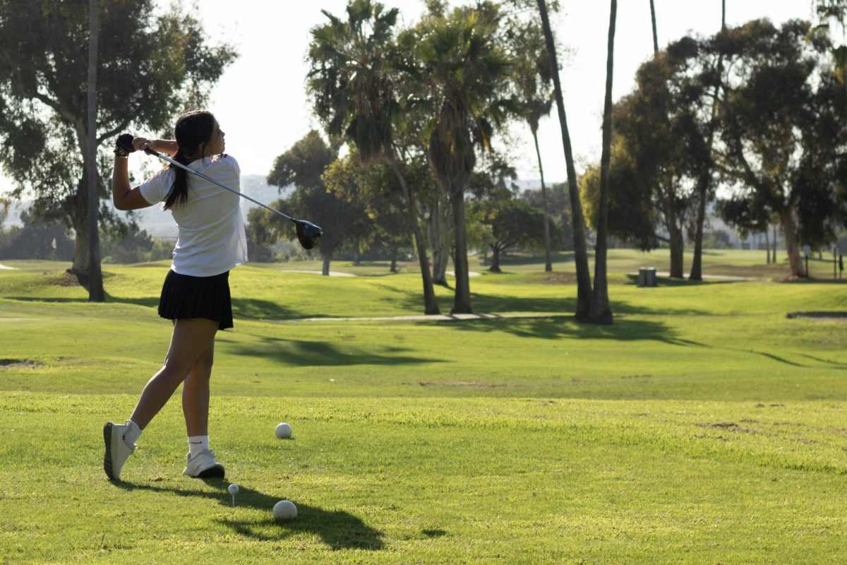 Freshman Joyce Huang finishes her swing at the first green, making sure to keep herself in the right mental state. “I would work on fixing my mindset,” Huang said. “I was frustrated on the first few holes, but I had to switch my mindset back. You’re affected by the last few shots when you’re frustrated, but you need to focus on the next few and shoot well.” 