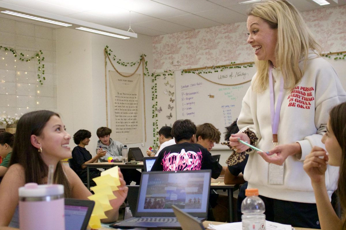 English teacher Amber Linehan discusses the novel “The Summer I Turned Pretty” with freshman Sophie Kingman as they wrap up their book club unit. “I love to just get lost in a book, and if I can encourage one or two people a year to find that love that didn't have it before, then I feel like I'm doing my job,” Linehan said. “I just want to embrace what's human about us and embrace kindness and working hard because that's what we have as humanity. That's what we want to keep going.”
