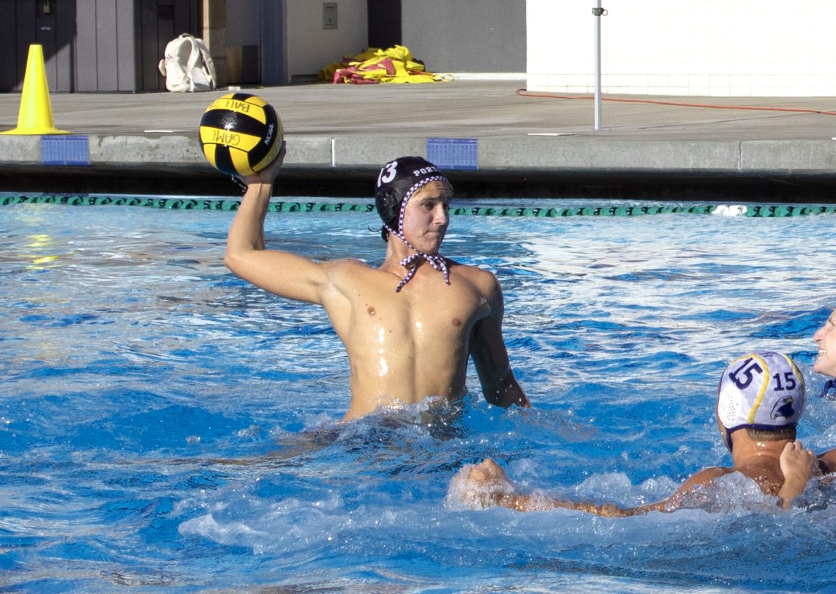 Utility player and senior Ryder Tonkovich prepares to shoot a goal against El Segundo High in the first quarter. Different players are substituted in and out of the match to create the most effective team dynamic, according to head boys’ water polo coach Kate Avery. “Especially in those close, competitive games, we want to keep the six or seven players that are performing the best and have the best chemistry to maintain momentum.” 