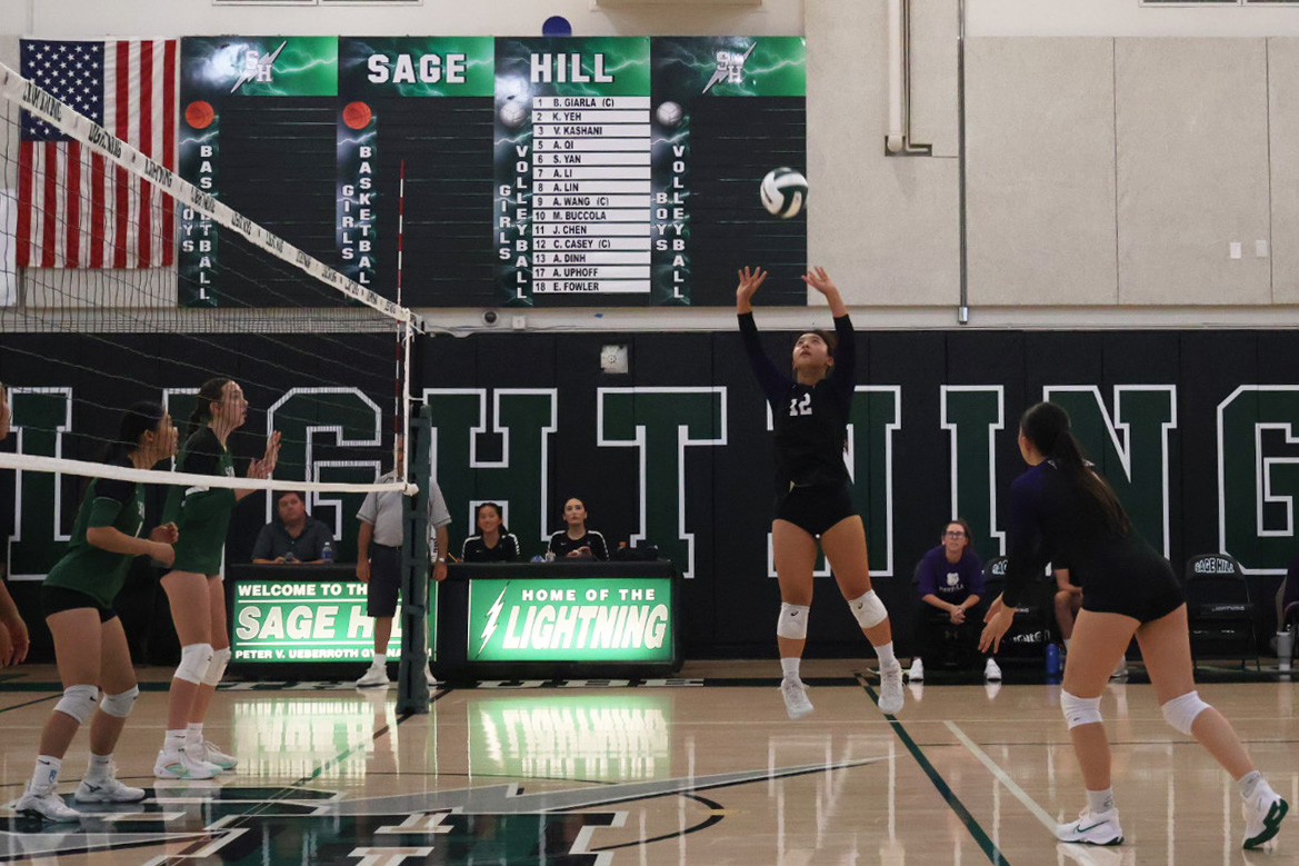 Setter and sophomore Jane Park jumps for the volleyball during the first set of the game. Park scored multiple points throughout the game through her serves, including the Bulldogs’ final point that won them the fifth set.  “The first two sets there were definitely moments where we were playing our normal subs, but then for the most part, I feel like it was a lot of still trying to figure out what we could do to get points,” co-captain, libero and senior Izzy Macasero said. “Once we finally did realize that, that's what helped us get these victorious moments.” 
