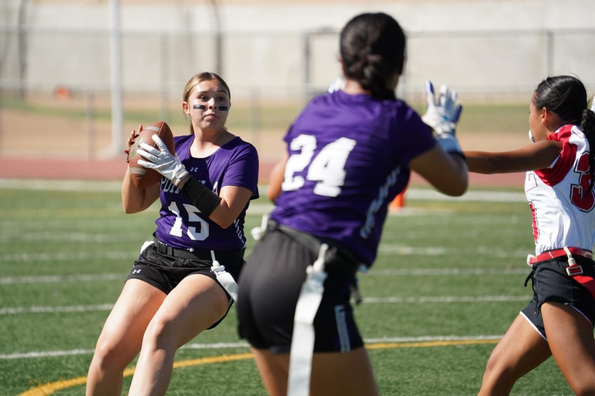  Quarterback and sophomore Alondra Hernandez passes to running back and sophomore Irene Kim in a game against Garden Grove High. “As the running back, I feel like we're a lot closer to the other receivers,” Kim said. “So if there's a situation where [Hernandez] has to get the ball out at the last minute and no one else is open, I'm always there for her, and that's where I feel like the communication comes into play.”