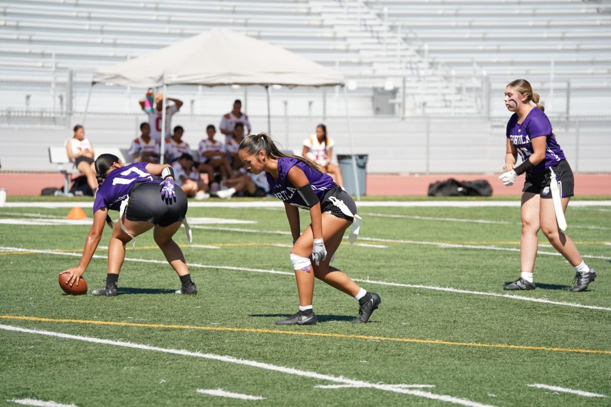 Hernandez prepares to lead an offensive play in a game against Garden Grove High. “The role of the quarterback is basically the leader on the field,” head coach Julie Primero said. “Everything goes through the quarterback first, so they run the offense.”