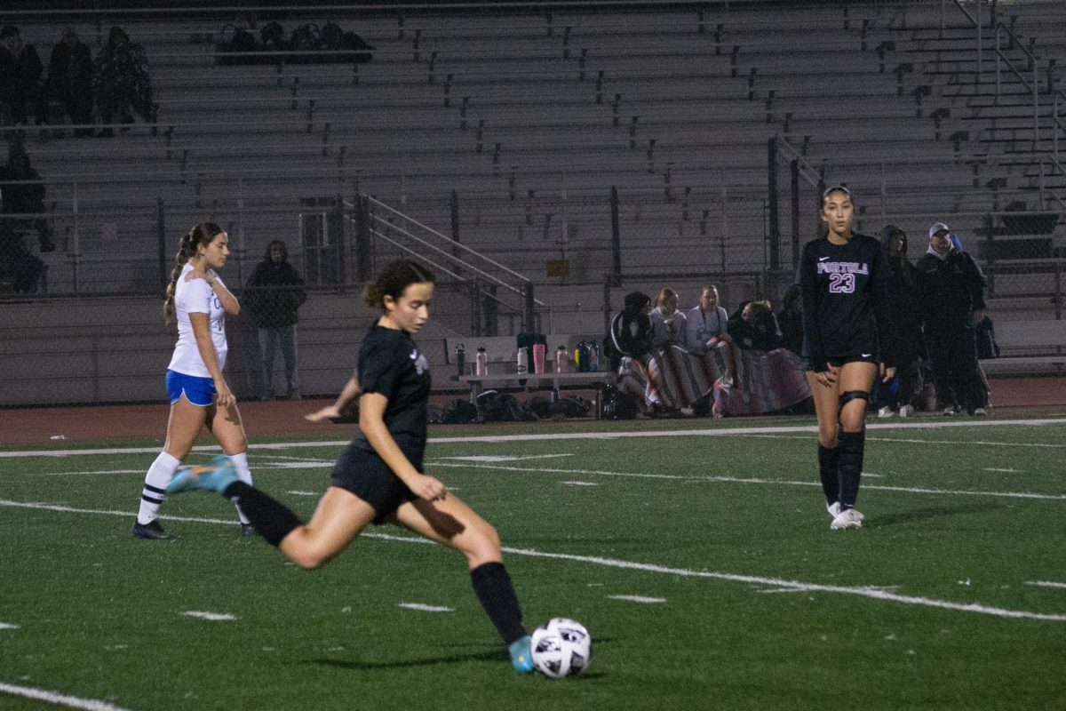 Captain, center-back and senior Malaika Fawzi takes a free kick from the 32-yard line in the first half. “I think that my role as captain is leading them both on and off the field,” Fawzi said. “Even if we’re down or we mess up or we get scored on, I’m making sure that everyone is working towards a positive goal and bringing each other up.”