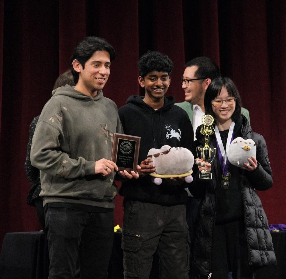 Co-captains senior Ellen Liu and junior Suhrith Muvvala stand alongside their advisor and science teacher Christian Quinteros to collect their sixth place overall plaque earned at the annual USC Science Olympiad Invitational. “So across the board, our placements have gotten a lot better, and we've gotten a lot more consistent among the 23 solo events, which is helping us place a lot better this year compared to last year,” Muvvala said. 