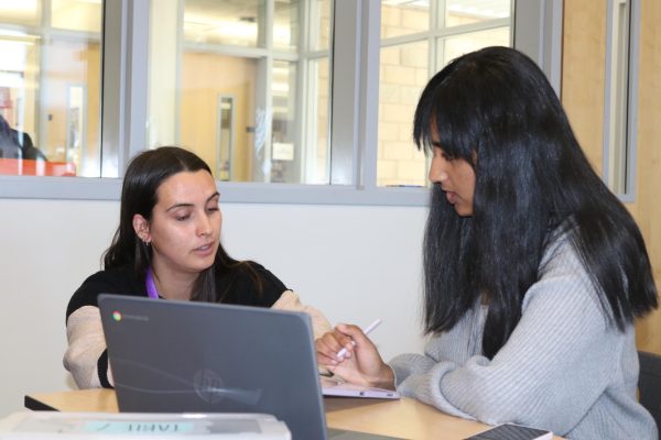 Pohle helps a student understand a calculus lesson during office hours. To help strengthen her relationships with her students, Pohle incorporates elements of her classroom in Madrid into Portola High. “It was cool to see how teachers run classes there because it's just very different,” Pohle said. “I feel like we're just so pressed for time especially in a high school environment. A big focus in Spain itself is connections with people, so everyone is just so friendly and nice.” 