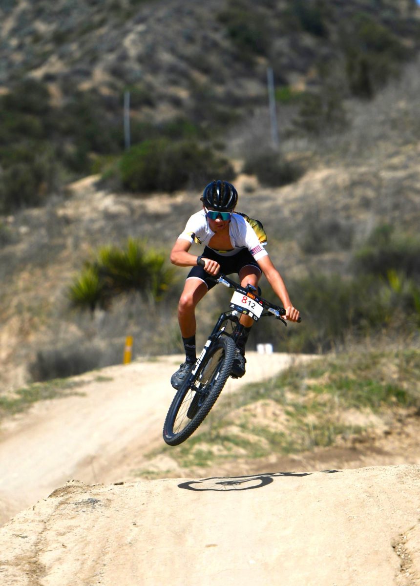 Freshman Carson Bagley rides over a bridge on a trail in Crystal Cove. While competing in races against numerous skilled riders, Bagley often feels the pressure to perform well. “It's hard to keep focused when you're racing with all the adrenaline and nerves,” Bagley said. “[The adrenaline] is just a feeling you want to go away because it gets you so nervous, but you can't really get it to go away with all the noise and all the people around you.”