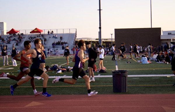 Distance runner and sophomore Nick Perez passes the 200-meter mark while running the 800-meter run, speeding up to catch up to and pass two runners. 
