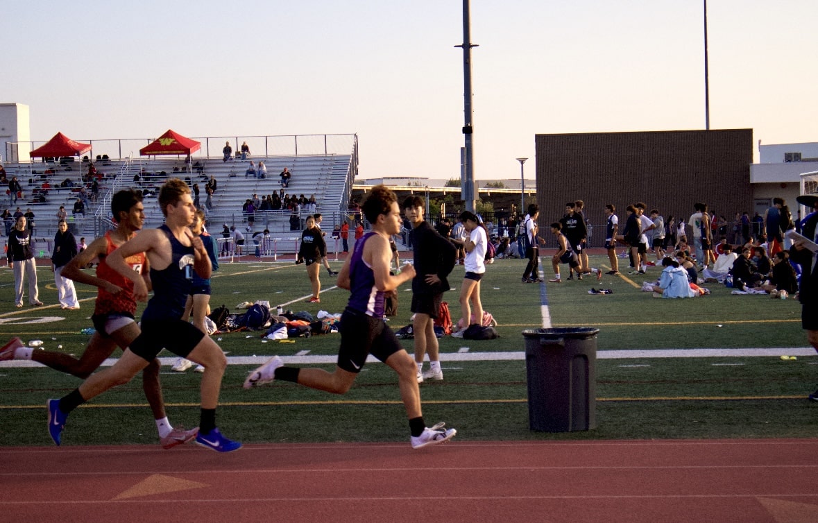 Distance runner and sophomore Nick Perez passes the 200-meter mark while running the 800-meter run, speeding up to catch up to and pass two runners. 
