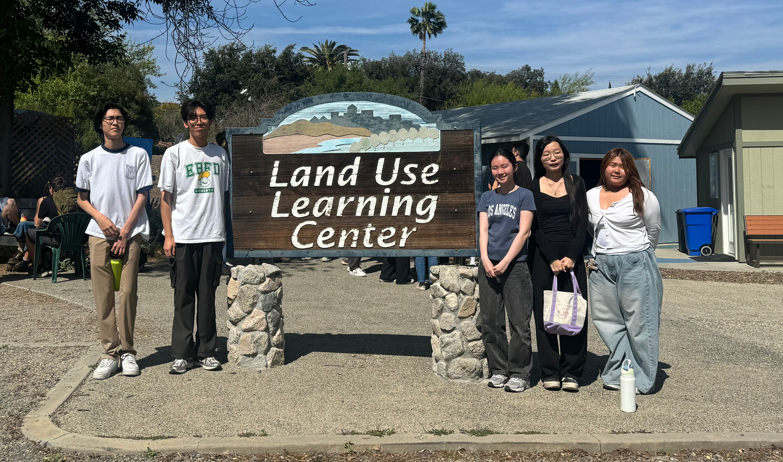 The Envirothon Club's leadership team poses in front of a sign at the NCF-Envirothon tournament in Riverside. “The goal of the Envirothon competition is to learn about natural resource conservation and what we can do to protect the environment,” said Lizardo. “The biggest part of the competition is presenting the plan that would help the natural environment.”