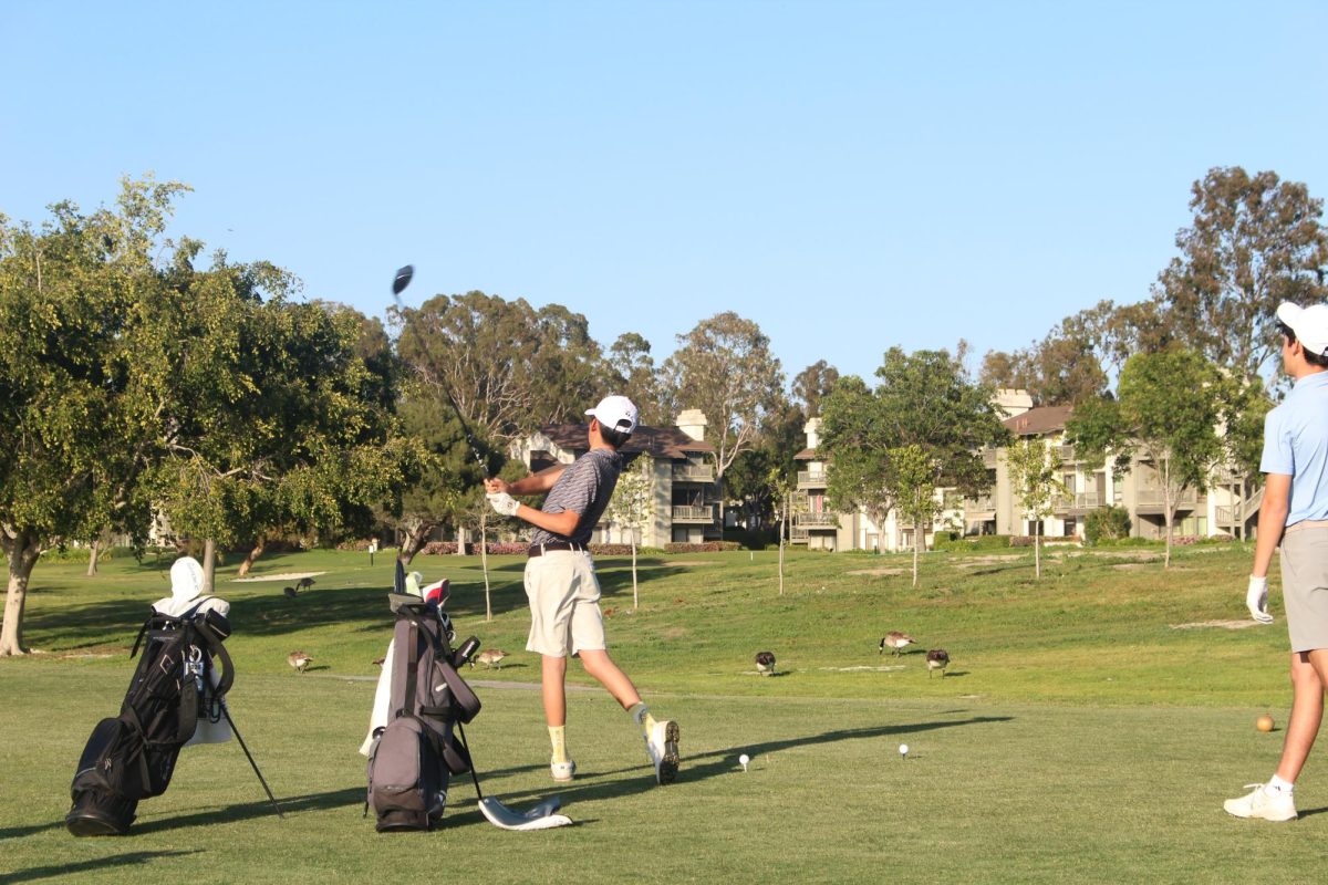 Freshman Ben Matusda tees off on the ninth hole.