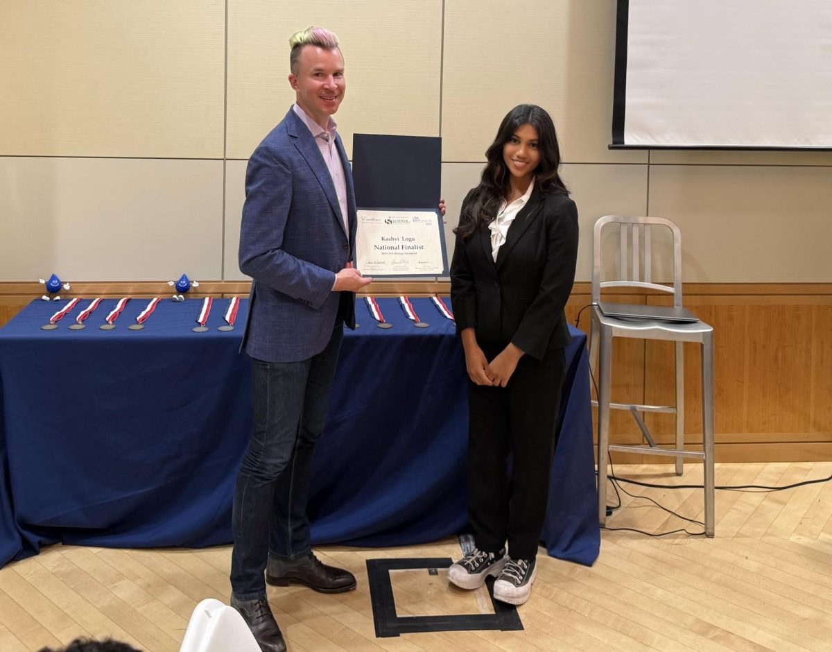 Kashvi Logu is presented with the USA Biology Olympiad national finalist award. “It was a great opportunity to get that award and finally say that I’ve succeeded,” Logu said.

