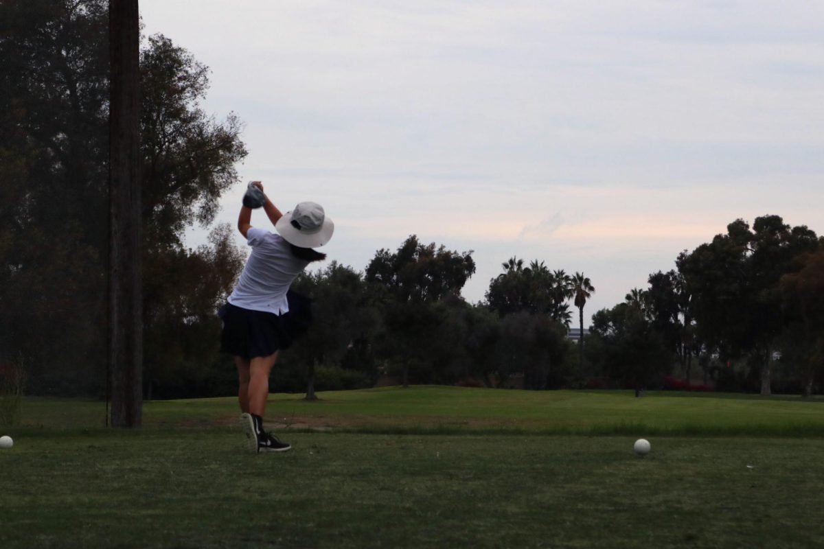 Freshman Lisa Li tees off at hole 7. “I’m currently working on fixing my swing to hit consistent straight shots and I’m excited to see how much I can improve in the upcoming rounds,” Li said.