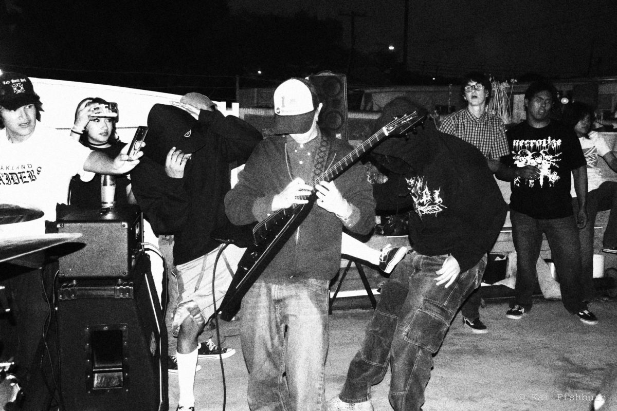 Jake Mendez plays lead guitar for his band, “Devout,” at the Remington x James set at a Santa Ana residents’ backyard on  September 17th, 2025,  “Gotta keep everyone united in order to make a difference.”