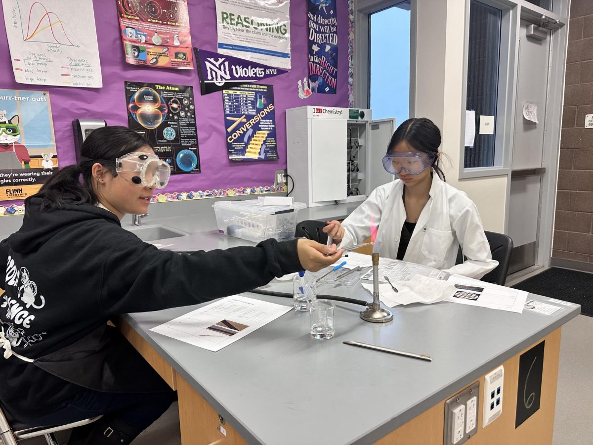 Portola High Science Olympiad member and junior Sophia Trinh works on her experiment for the Forensics event. “I think our team is all very friendly,” sophomore Kassidy Winata said. “When we take the test, it's pretty competitive, but once we get back to our home base of all the Portola High students, we're all just talking and chatting about our tests and how our days are going.” 